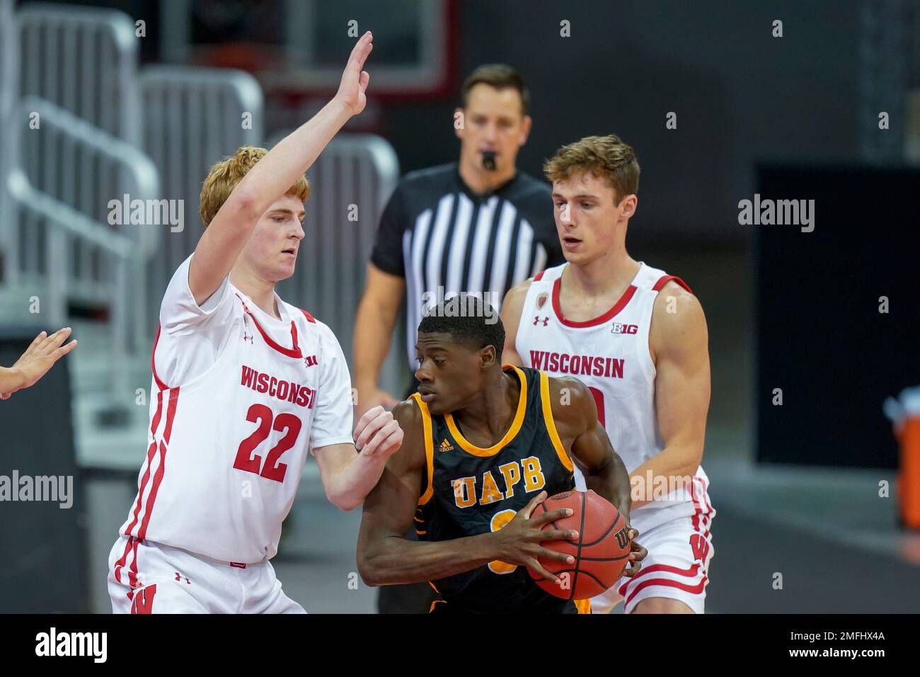 Wisconsin's Steven Crowl (22) and Ben Carlson (20) trap ArkansasPine
