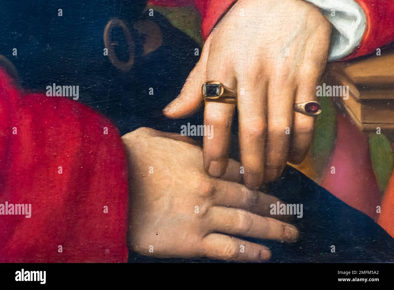Details des Renaissance-Gemäldes in Nahaufnahme männlicher weißer Hände mit Ringen Stockfoto