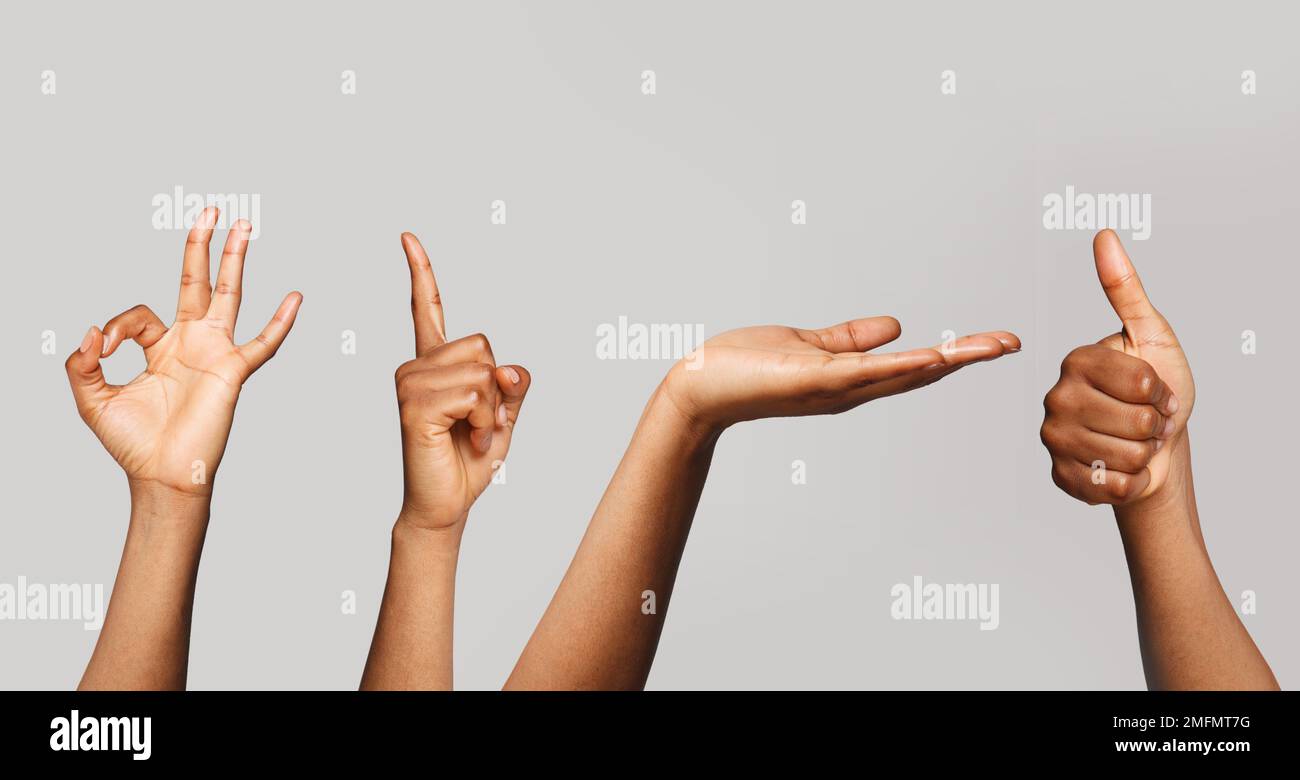 Ein Paar schwarze weibliche Hände. Okay, zeigen, Daumen nach oben und offene Handbewegung Stockfoto