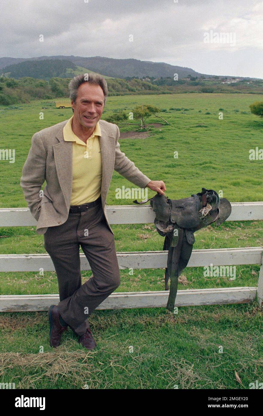 FILE In this April 7, 1986 file photo, actor Clint Eastwood leans against a fence on the last
