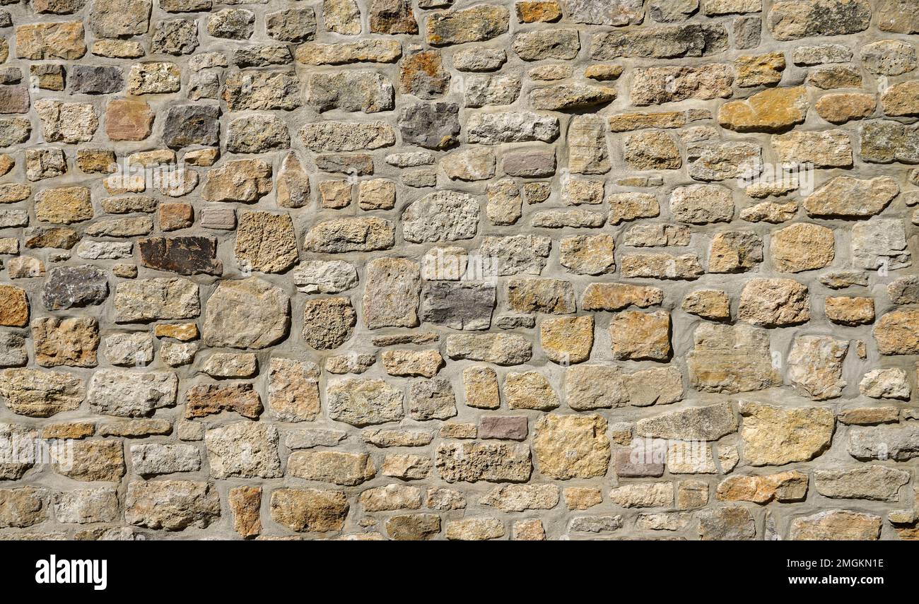 Hellbraune antike Steinwand als Hintergrund. Stockfoto
