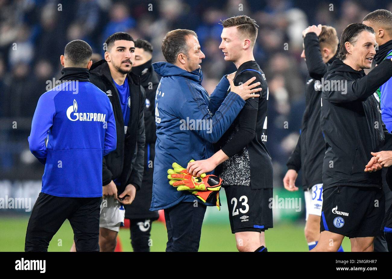 Bayern's manager Hansi Flick, left, comforts Schalke's goalkeeper Markus Schubert after the German soccer cup, DFB Pokal, quarter-final match between FC Schalke 04 and Bayern Munich in Gelsenkirchen, Germany, Tuesday, March 3, 2020. (AP Photo/Martin Meissner) Stockfoto