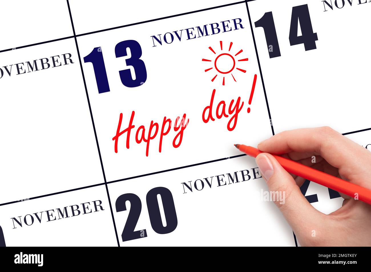 13. Novembertag. Schreiben Sie mit der Hand den Text HAPPY DAY und Drawing the Sun am Kalenderdatum November 13. Merken Sie sich das Datum vor. Feiertage. Motivation. Herbst Stockfoto