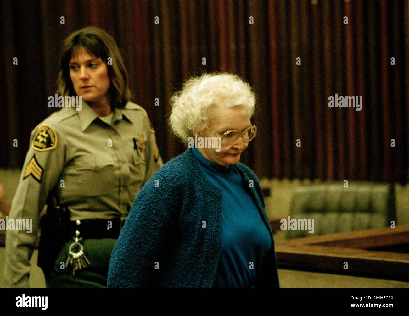 Sacramento, Calif., landlady Dorothea Puente is escorted by a deputy(01)