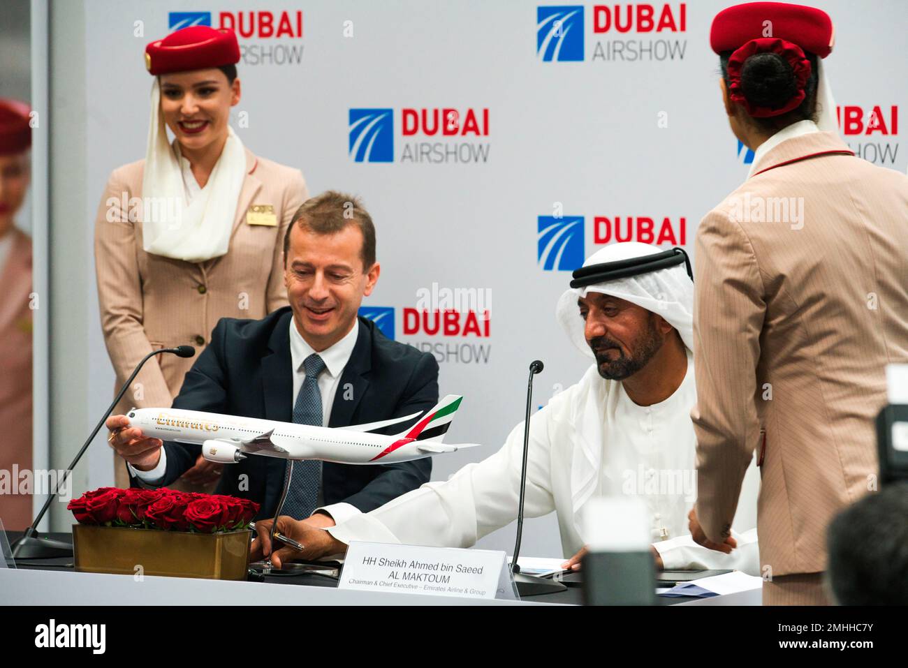 Airbus CEO Guillaume Faury, left, touches a model of an Airbus aircraft