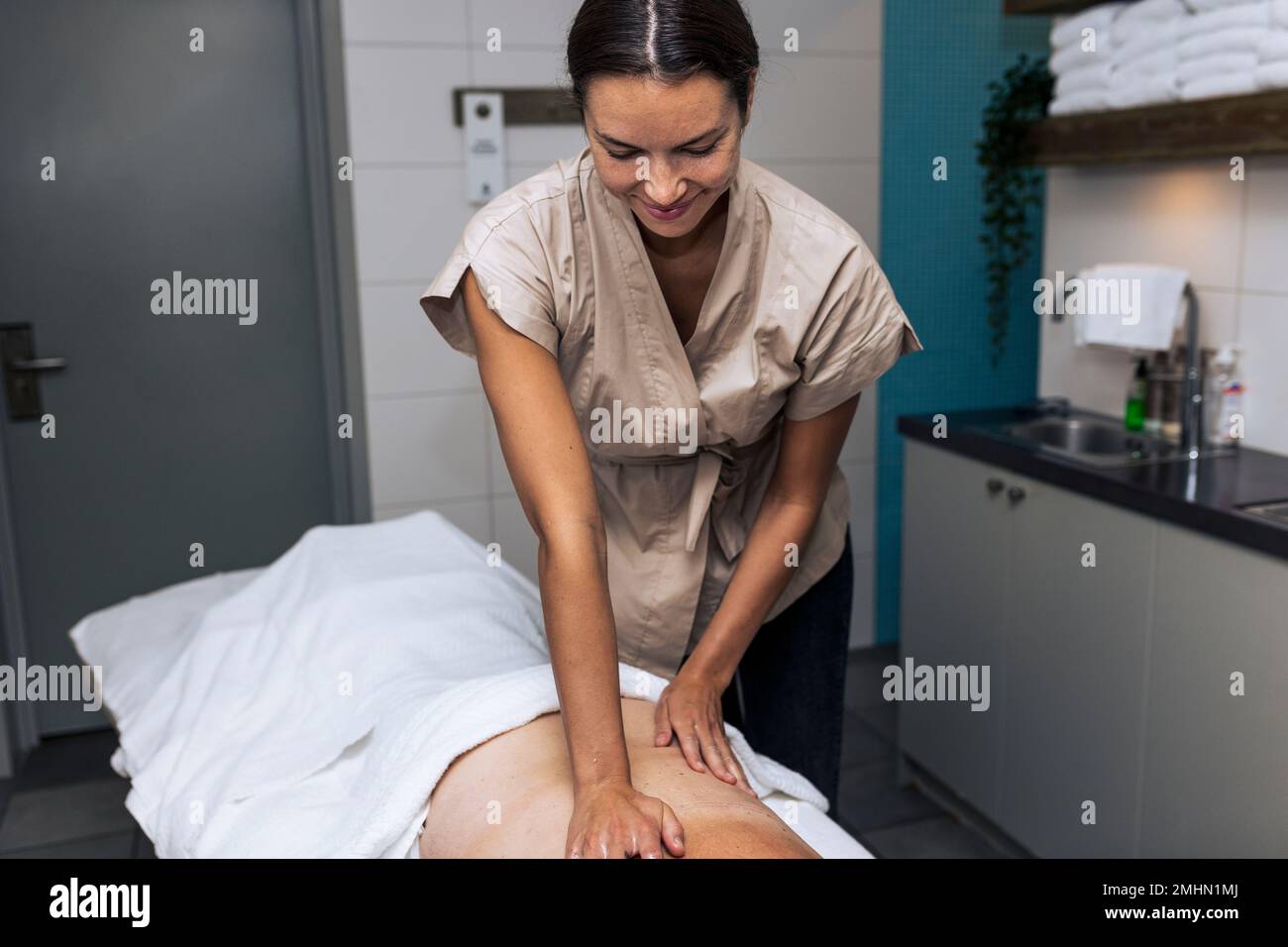Person, die sich massiert Stockfoto