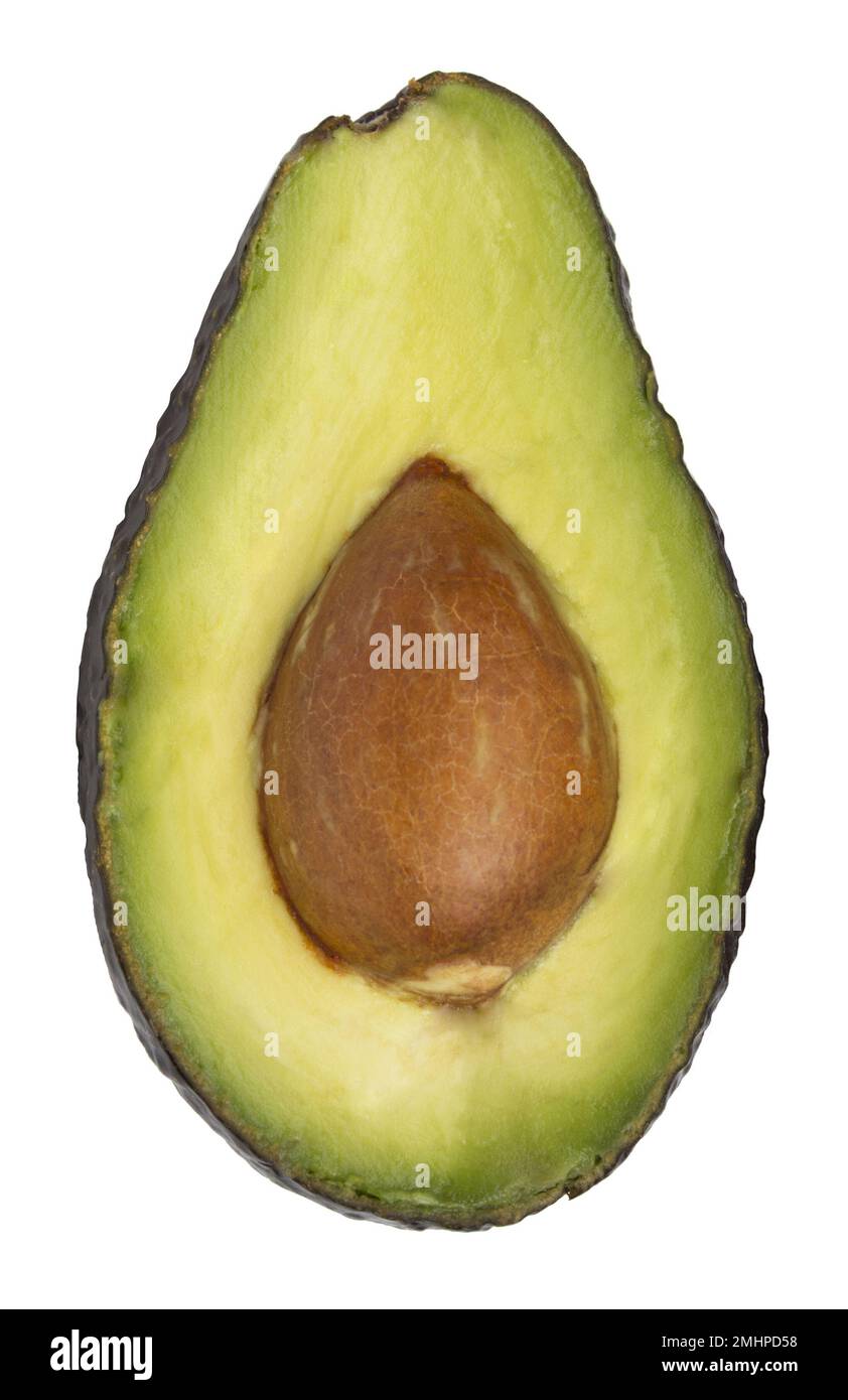 Avocadofrüchte, mit Samen in zwei Hälften geschnitten Stockfoto