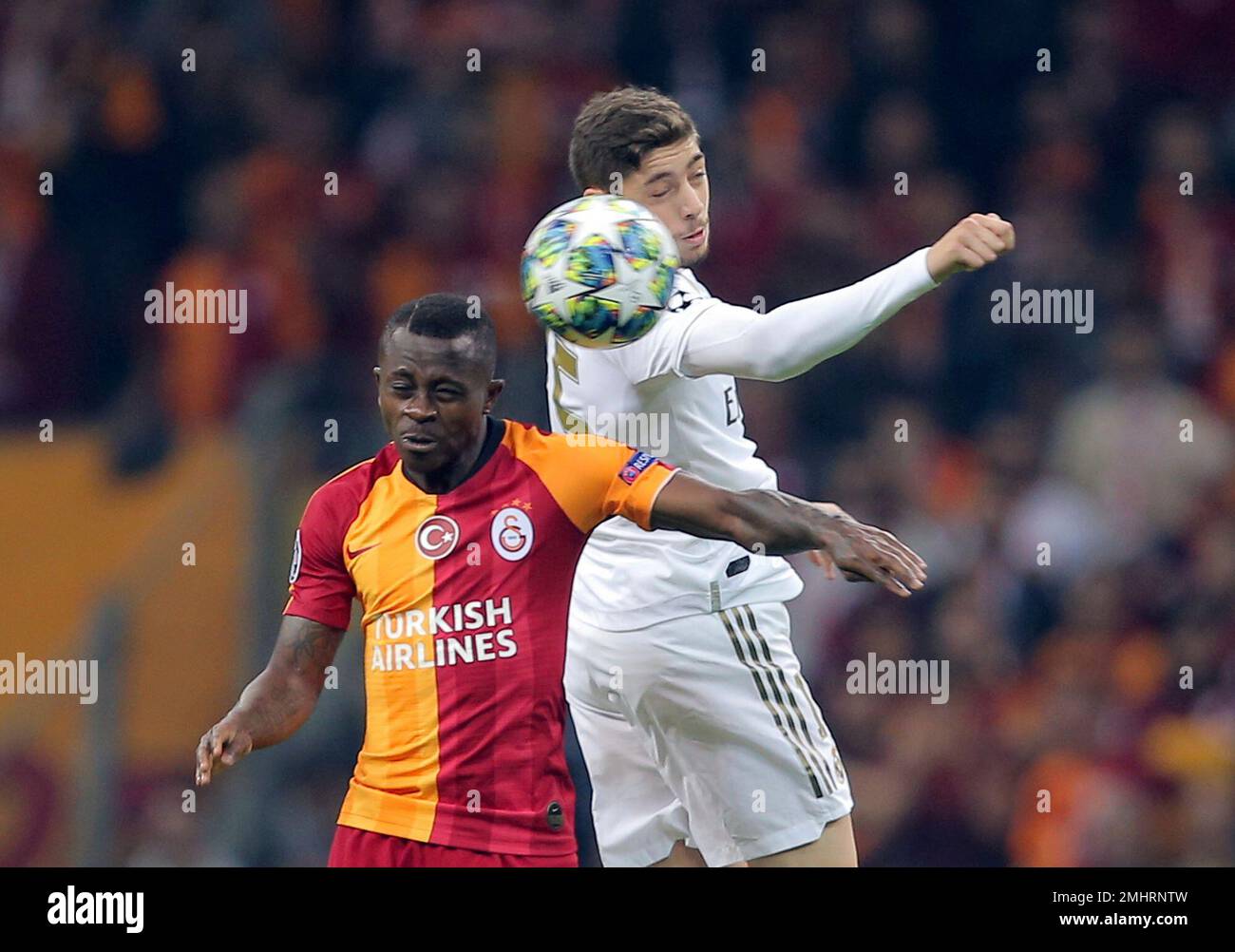 Real Madrid's Federico Valverde, right, jumps for the ball with Galatasaray's Jean Michael Seri during the Champions League group A soccer match between Galatasaray and Real Madrid in Istanbul, Tuesday, Oct. 22, 2019. (AP Photo) Stockfoto