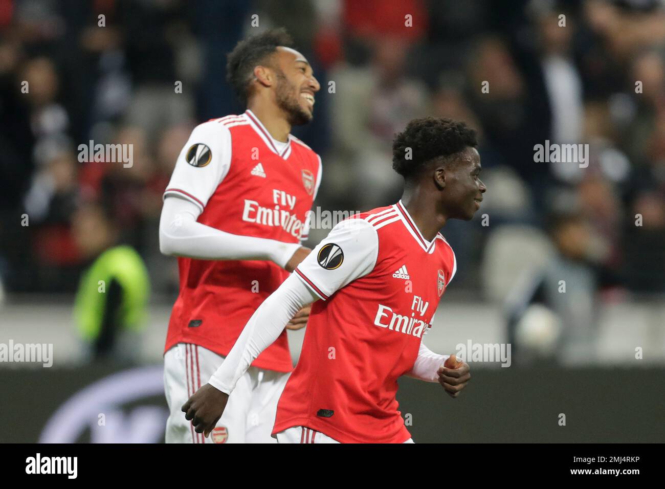 Arsenal's Pierre-Emerick Aubameyang, left, celebrates with Arsenal's Bukayo Saka after scoring his side's third goal during the Europa League Group F soccer match between Eintracht Frankfurt and Arsenal in the Commerzbank Arena in Frankfurt, Germany, Thursday, Sept. 19, 2019. (AP Photo/Michael Probst) Stockfoto