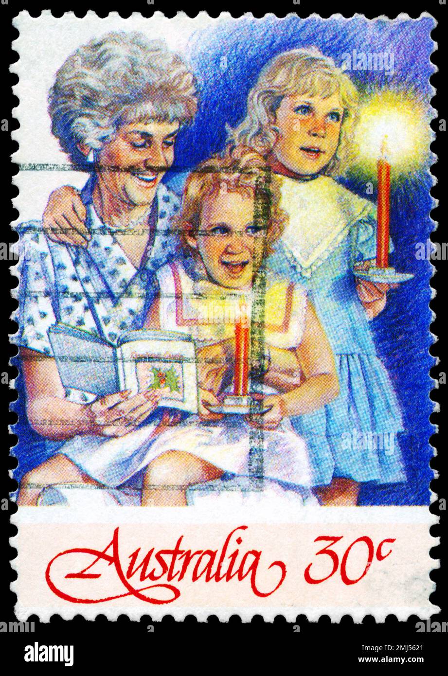 AUSTRALIEN - CA. 1987: Ein in AUSTRALIEN gedruckter Stempel zeigt die Großmutter und zwei Mädchen, Weihnachtsserie, ca. 1987 Stockfoto