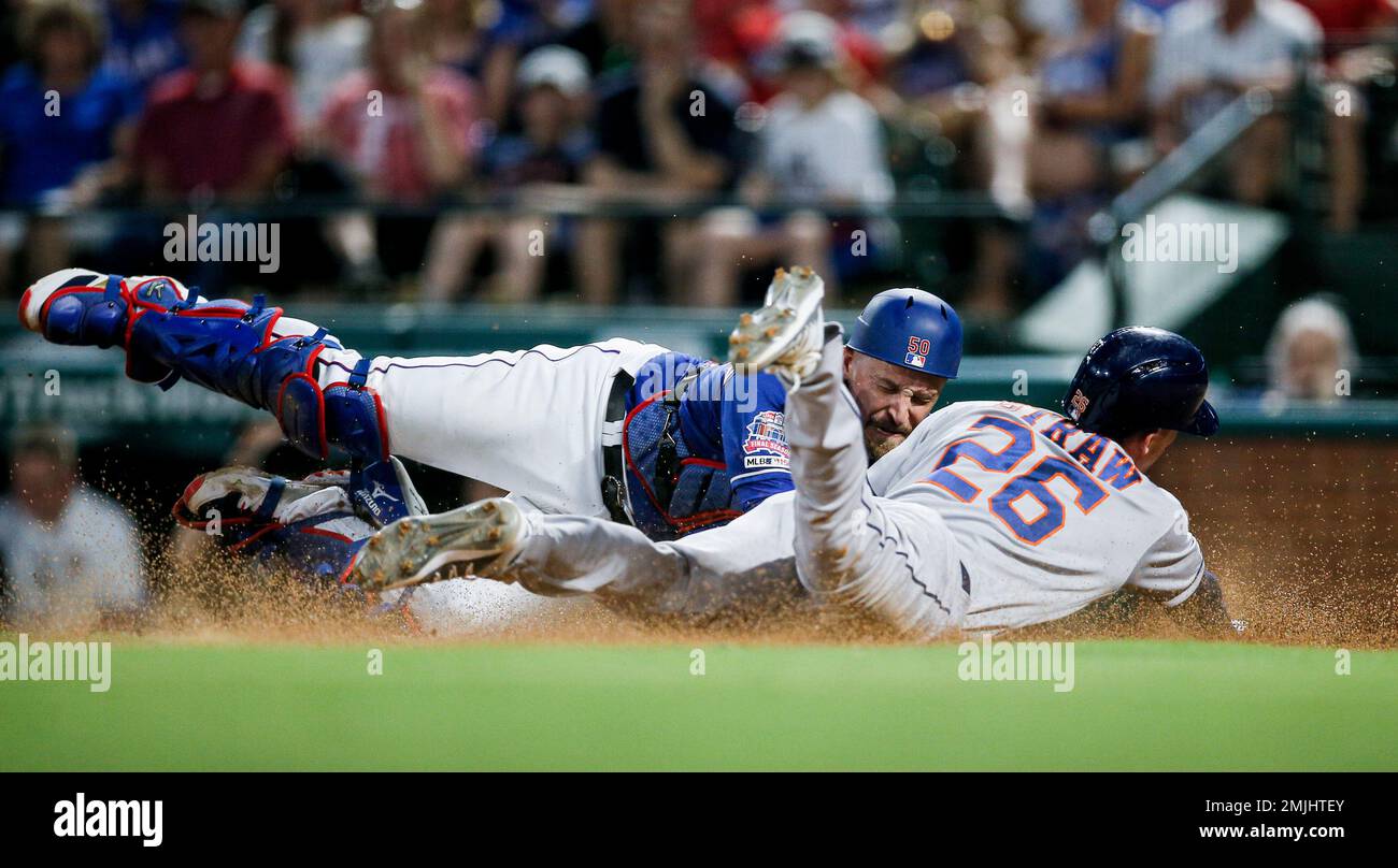 Texas Rangers catcher Tim Federowicz (50) tags out Houston Astros' Myles Straw (26) at home during the sixth inning of a baseball game, Friday, July 12, 2019, in Arlington, Texas. Texas won 9-8. (AP Photo/Brandon Wade) Stockfoto