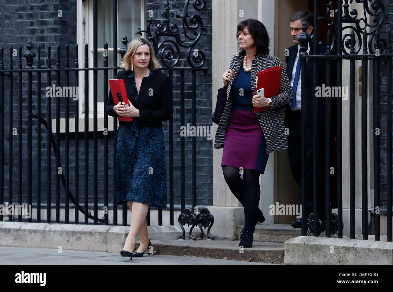 Amber Rudd, Britain's Secretary of State for Work and Pensions, left, Claire Perry, the Minister of State for Energy and Clean Growth, centre, and David Gauke, Lord Chancellor and Secretary of State for Justice leave 10 Downing Street following a cabinet meeting in London, Tuesday, Feb. 26, 2019. (AP Photo/Alastair Grant) Stockfoto