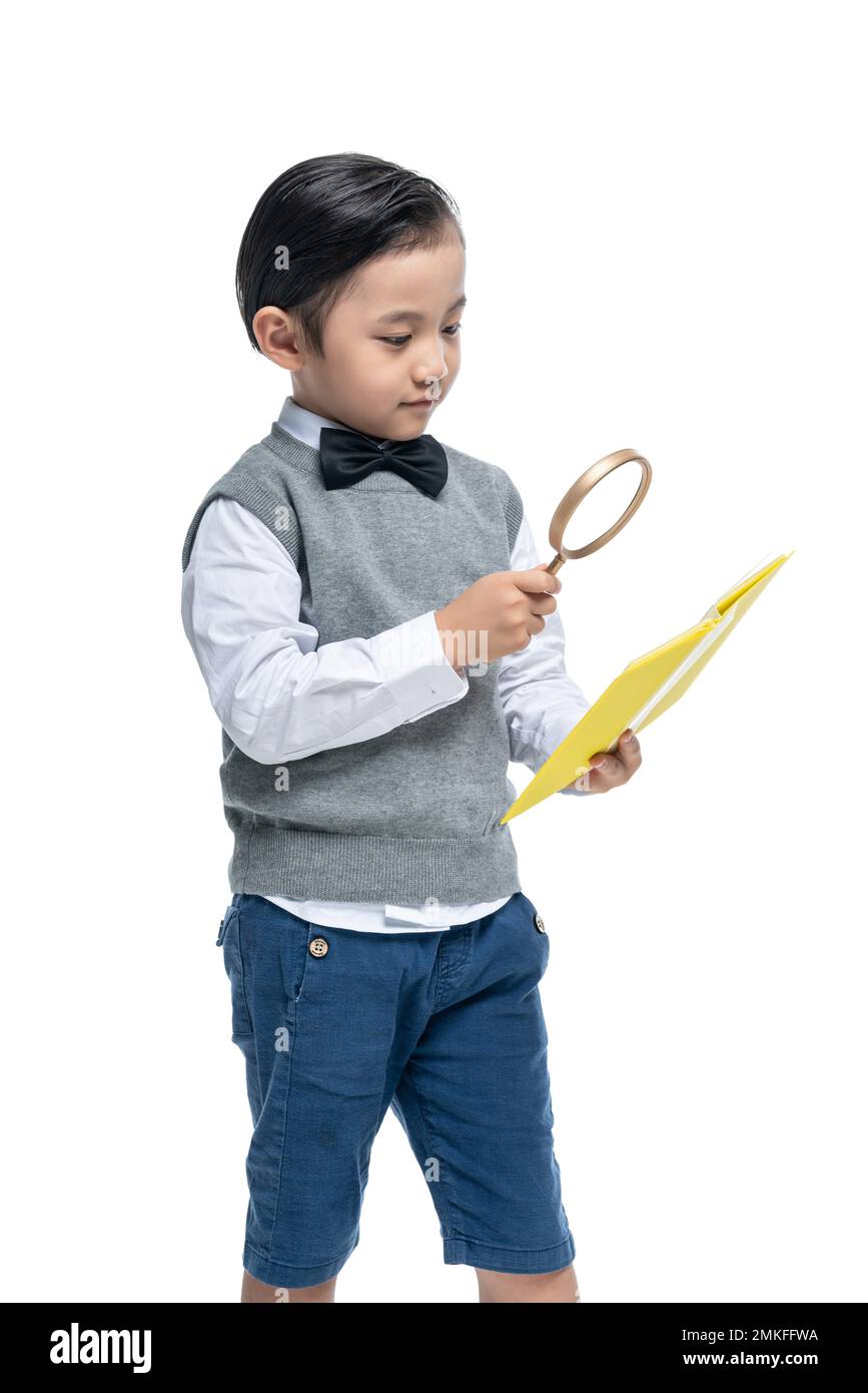 Der kleine Junge mit der Lupe Stockfoto