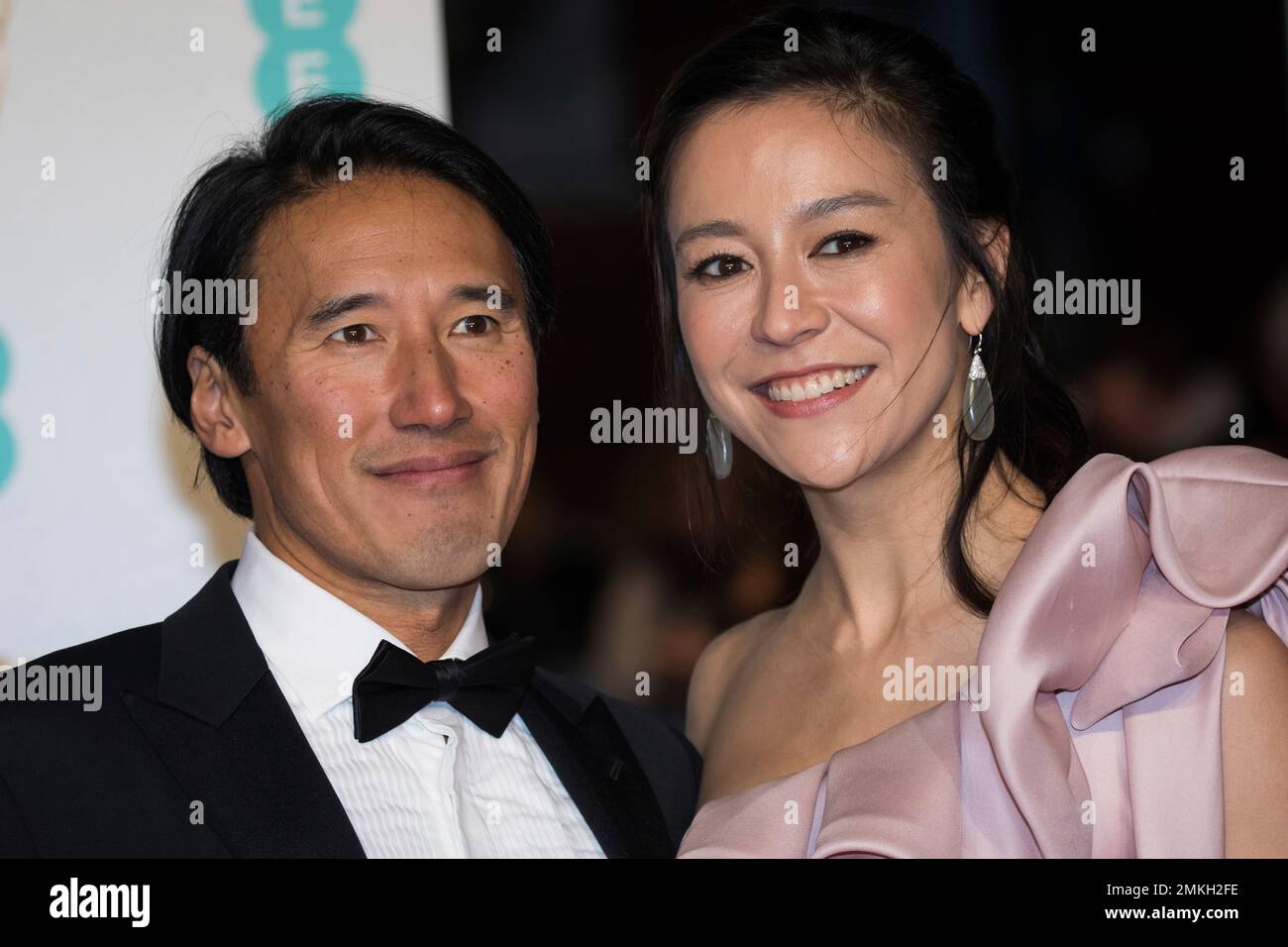 Jimmy Chin and Elizabeth Chai Vasarhelyi pose for photographers upon arrival at the BAFTA Film Awards in London, Sunday, Feb. 10, 2019. (Photo by Vianney Le Caer/Invision/AP) Stockfoto