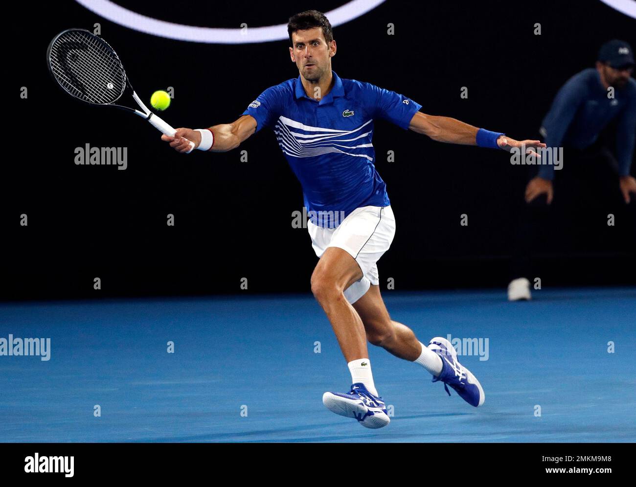 Serbia's Novak Djokovic makes a forehand return to France's Lucas Pouille during their semifinal at the Australian Open tennis championships in Melbourne, Australia, Friday, Jan. 25, 2019. (AP Photo/Mark Schiefelbein) Stockfoto