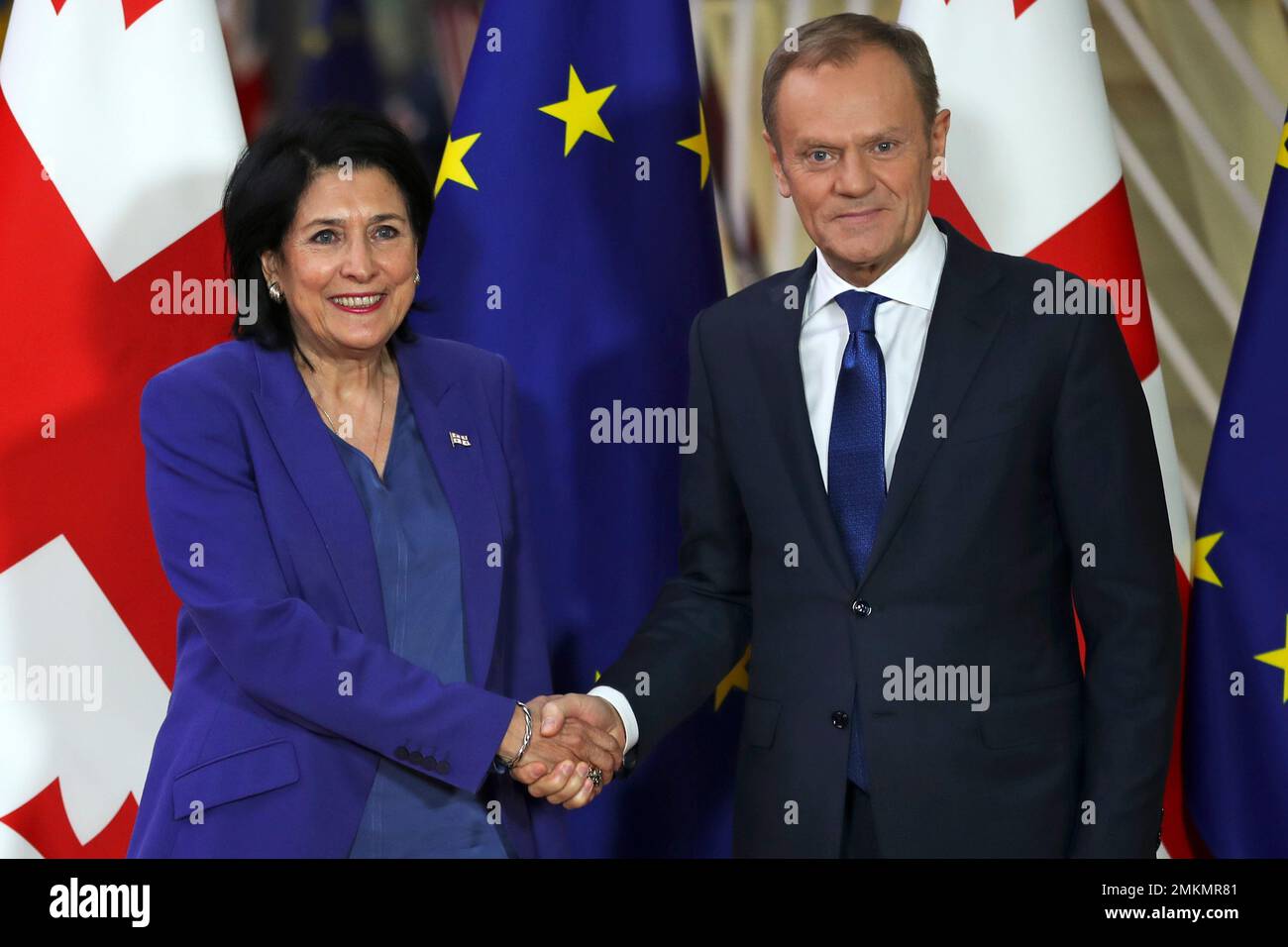 President Salome Zourabichvili, left, shakes hands for the