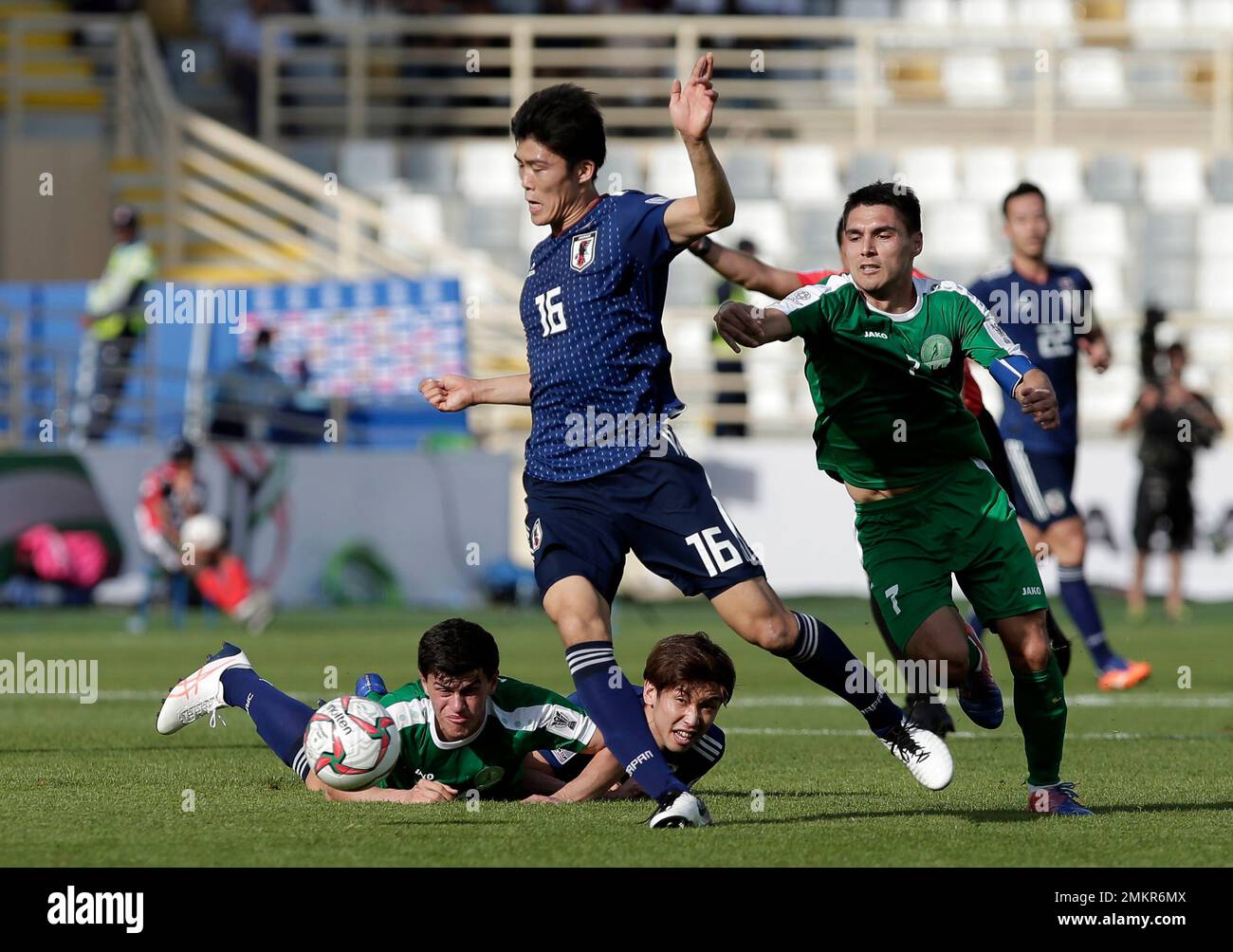 Japan's defender Takehiro Tomiyasu, front center, duels for the ball