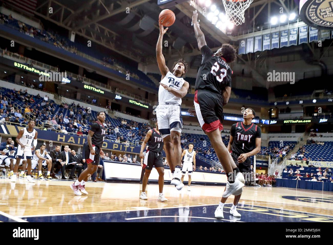 Pittsburgh's Au'Diese Toney, center, shoots over Troy's Jordon Varnado
