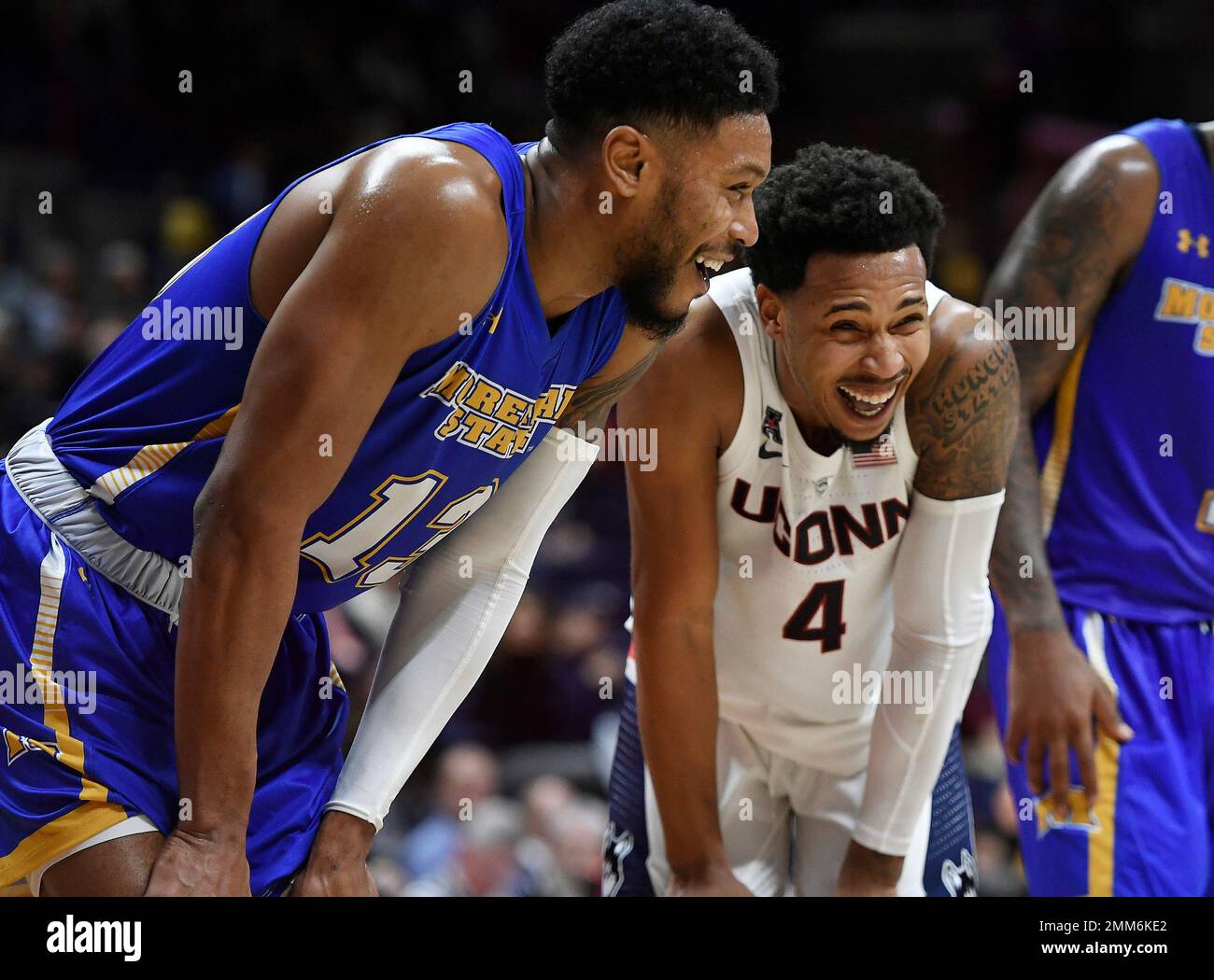 Morehead State's Lamontray Harris, left, and Connecticut's Jalen Adams laugh during the second half of an NCAA college basketball game in Storrs, Conn., Thursday, Nov. 8, 2018. (AP Photo/Jessica Hill) Stockfoto
