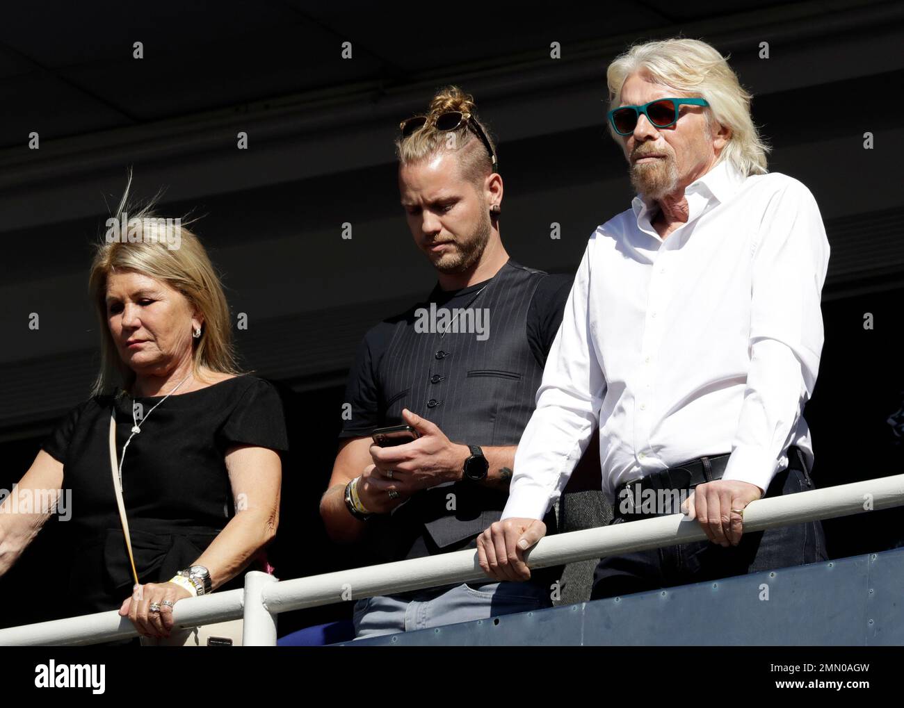 Britain's Richard Branson, right, with his son Sam Branson, center, and(02)