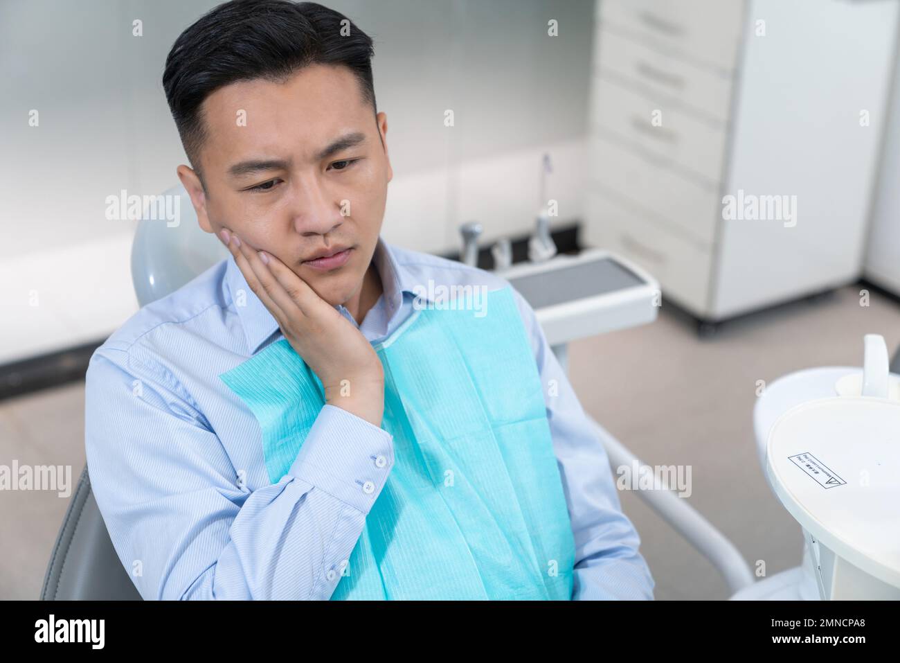 Zahnschmerzpatienten in der Zahnklinik Stockfoto