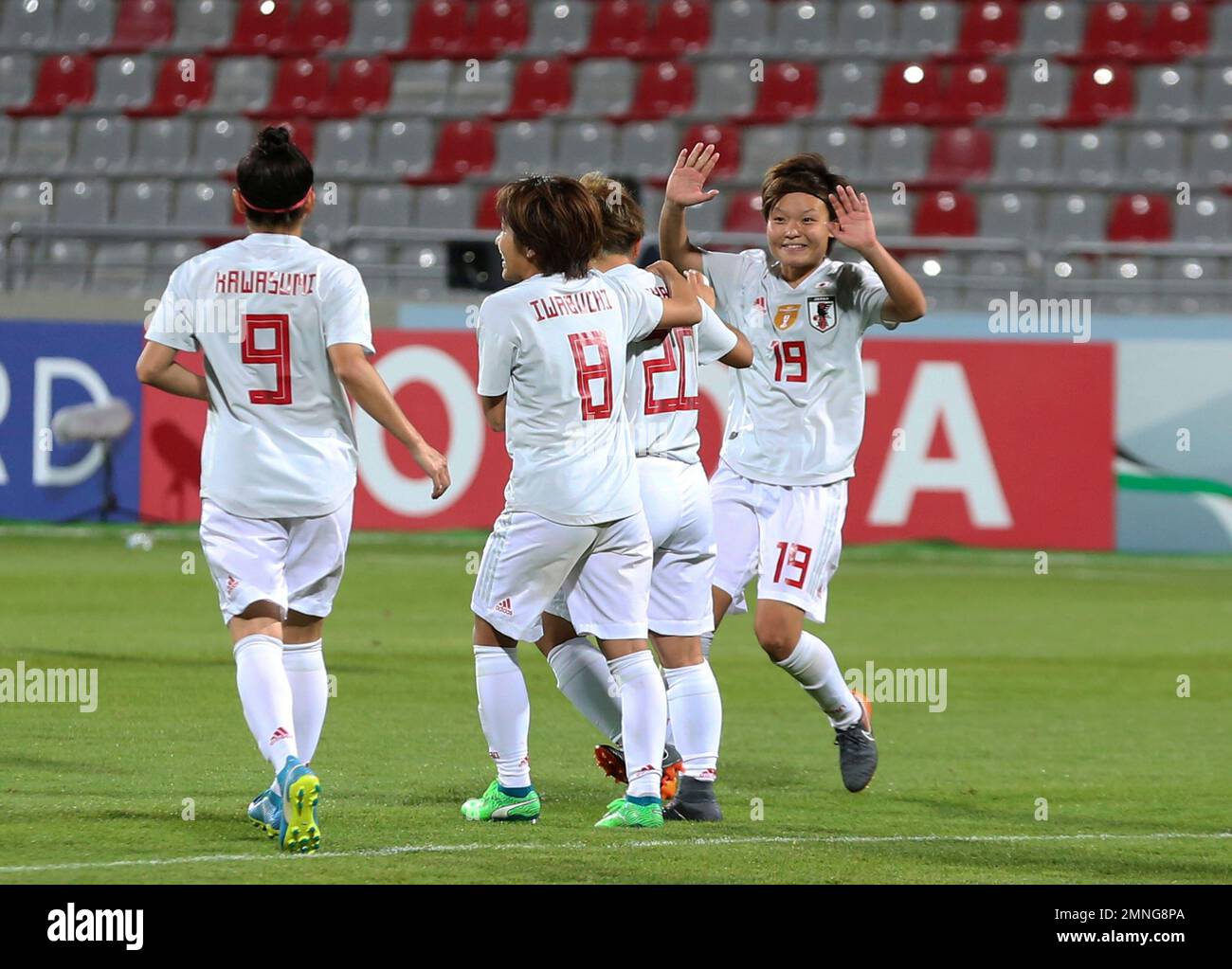 Japan's players celebrate after scoring during at the AFC Jordan 2018 Women's Asian Cup at Amman International Stadium in Amman, Jordan, Tuesday, April 17, 2018. (AP Photo/Raad Adayleh) Stockfoto