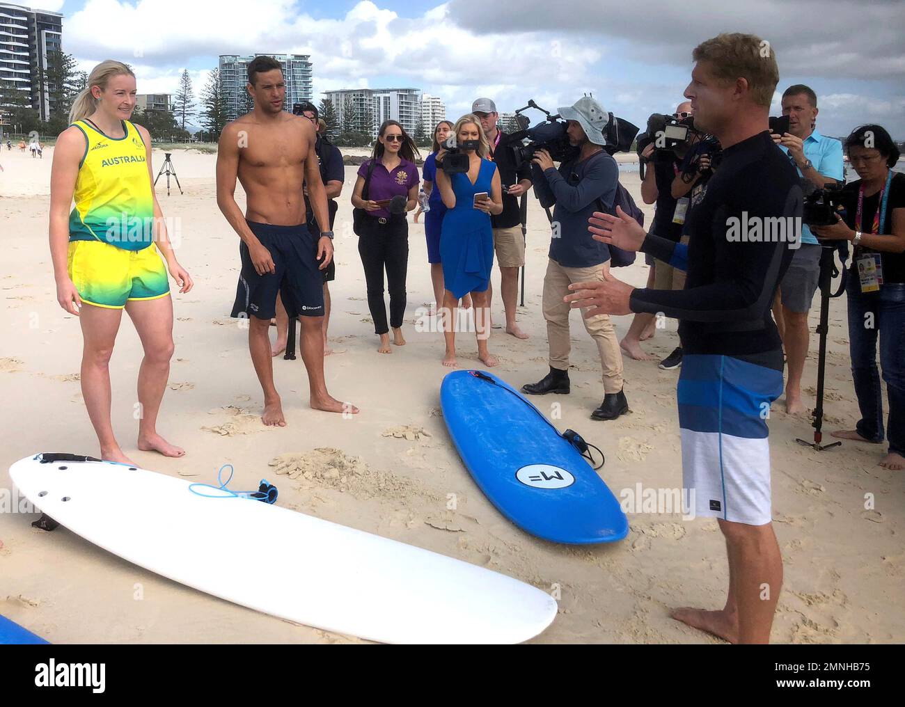 Australian surf legend Mick Fanning , right, talks to South African swimmer Chad Le Clos, right
