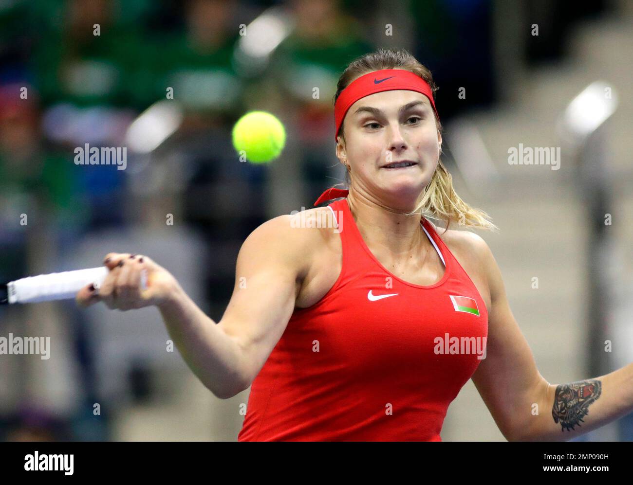 Aryna Sabalenka of Belarus returns a ball to Tatjana Maria of Germany during the Fed Cup World Group first round match between Belarus and Germany in Minsk, Belarus, Saturday, Feb. 10, 2018. (AP Photo/Sergei Grits) Stockfoto