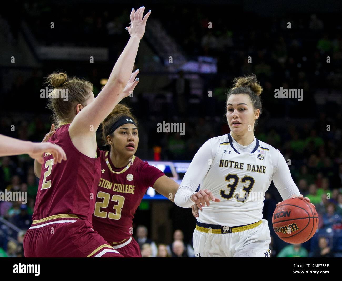 Notre Dame's Kathryn Westbeld (33) gets pressure from Boston College's