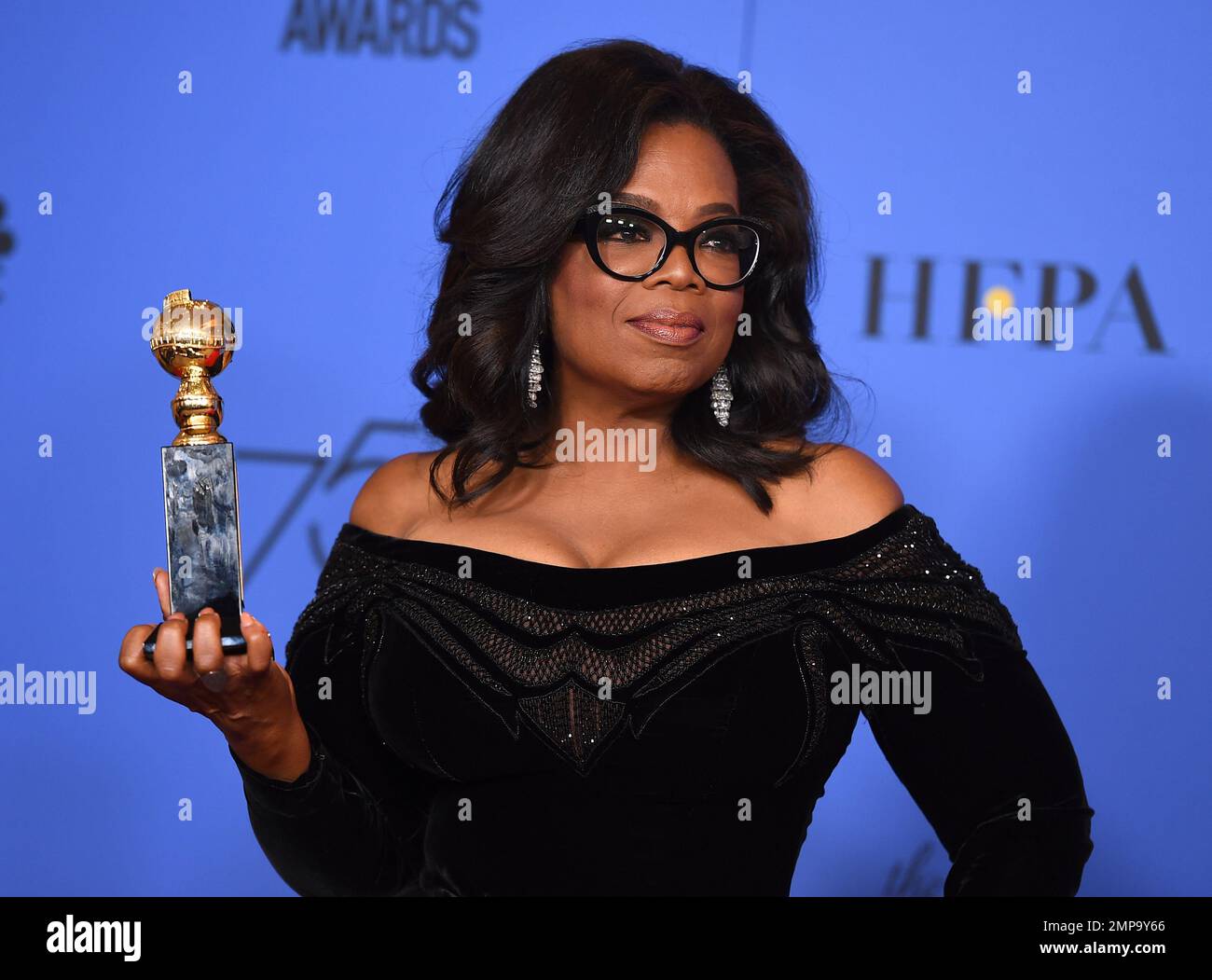 Oprah Winfrey poses in the press room with the Cecil B. DeMille Award