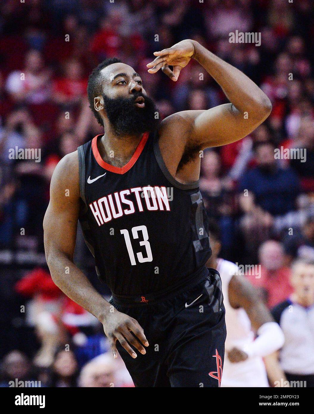 Houston Rockets guard James Harden celebrates a 3-point shot against the Los Angeles Clipers early in an NBA basketball game Friday, Dec. 22, 2017, in Houston. (AP Photo/George Bridges) Stockfoto