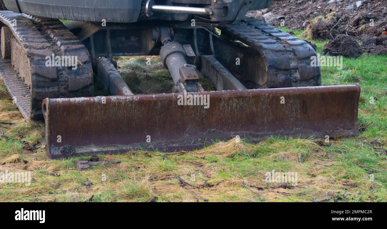 Baggerlader (Heavy Construction Machinery), die auf einem örtlichen Park arbeiten Stockfoto