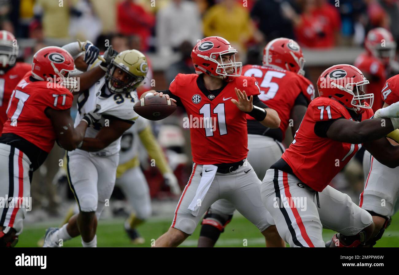 Georgia quarterback Jake Fromm (11) works against Georgia Tech during the first half of an NCAA college football game, Saturday, Nov. 25, 2017, in Atlanta. (AP Photo/Mike Stewart) Stockfoto