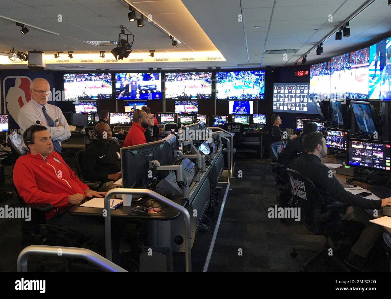 Joe Borgia, standing left, NBA senior vice president of replay and referee  operations, talks to senior replay manager Monte Shubik at the National  Basketball Association Replay Center in Secacus N.J., Thursday, Nov.