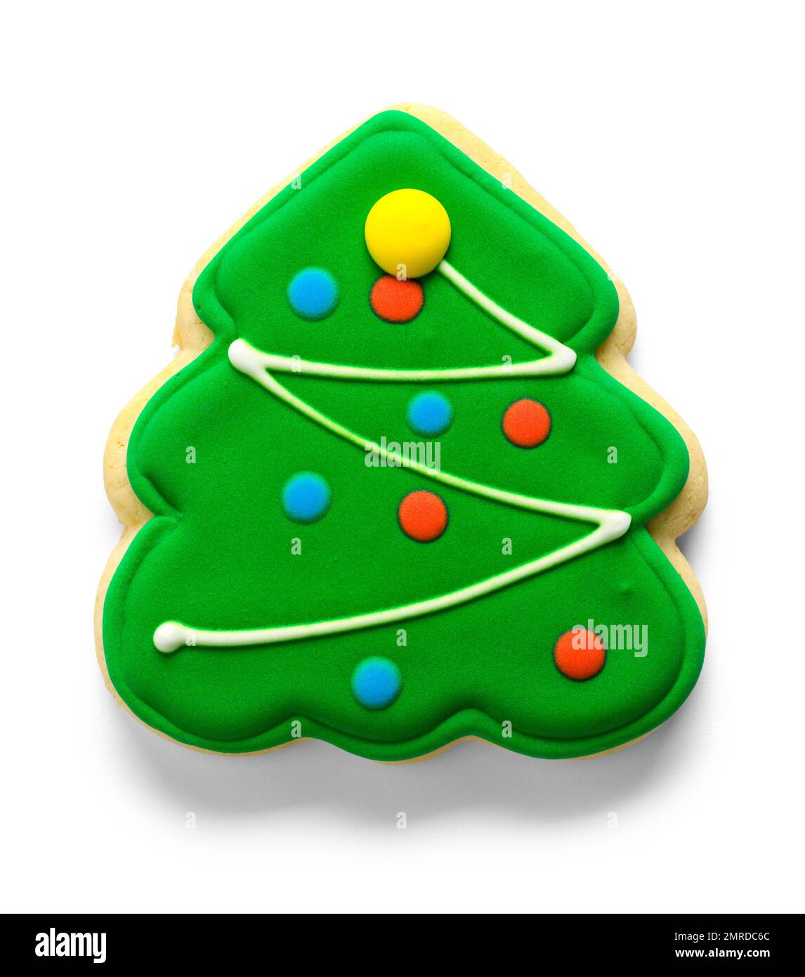 Grüner Frosted Christmas Tree Sugar Cookie auf Weiß ausgeschnitten. Stockfoto