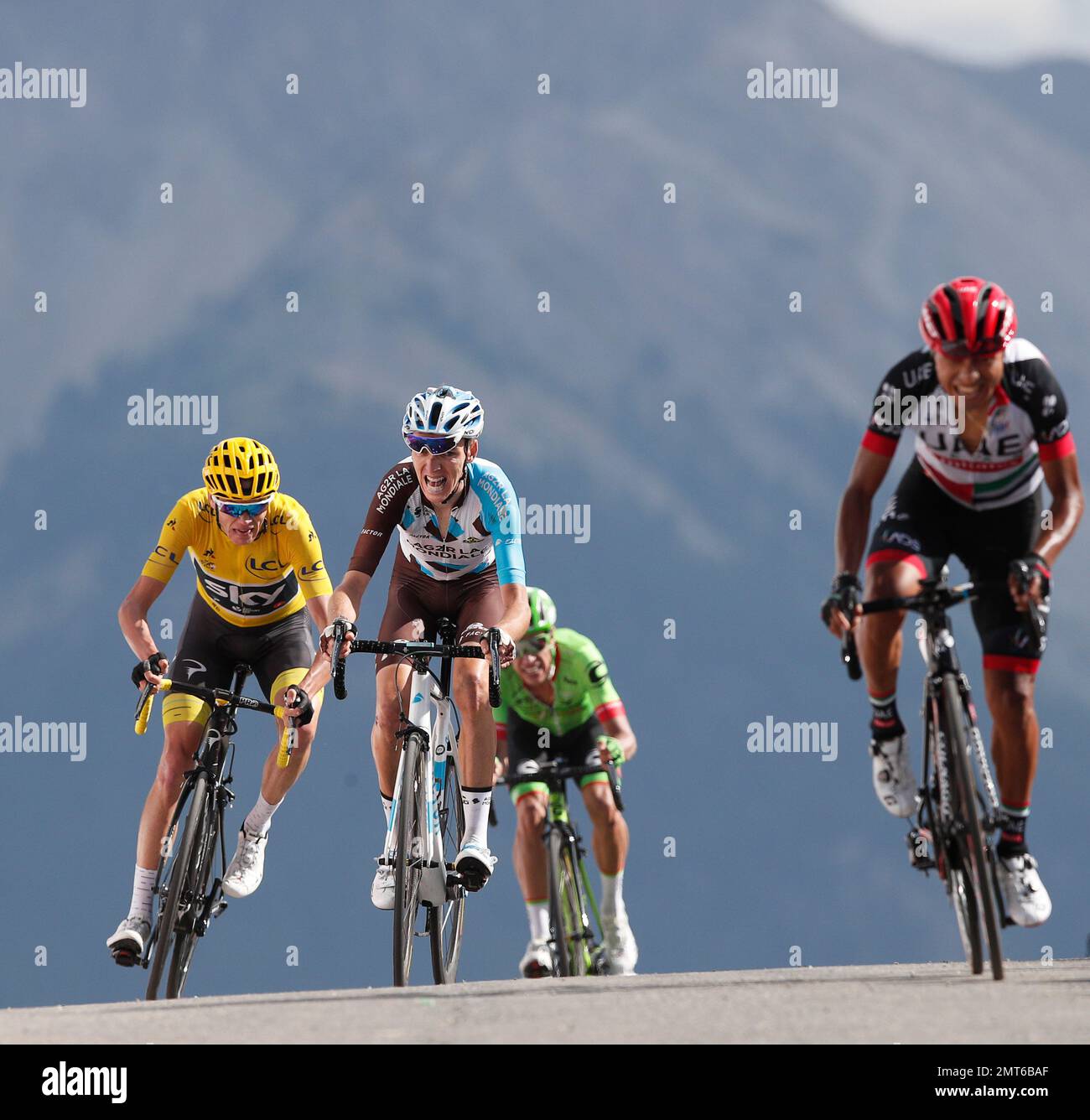 Britain's Chris Froome, wearing the overall leader's yellow jersey ...