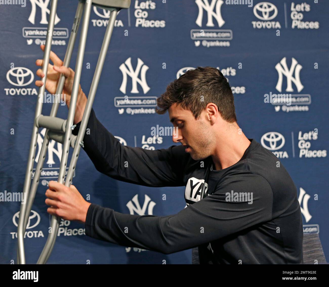 New York Yankees outfielder Dustin Fowler carefully places his crutches