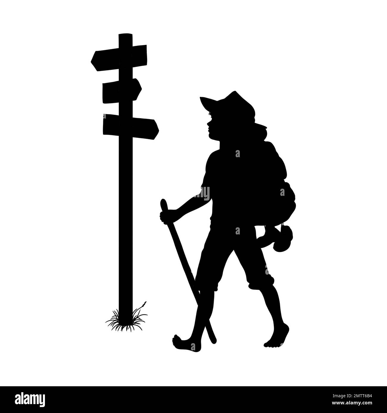Schwarze Silhouette eines Jungen oder Reisenden, der barfuß mit einem Rucksack und Gehstock wandert oder auf dem Walzer ist und an einem Wegweiser vorbeiläuft Stockfoto