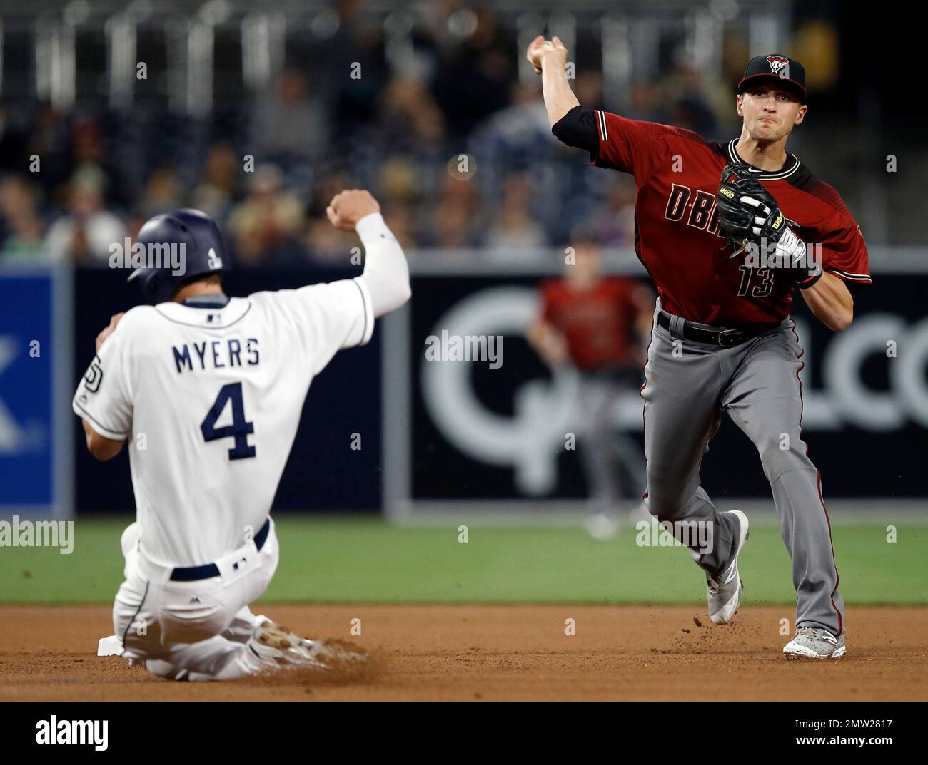 San Diego Padres' Wil Myers, left, gets forced out at second, as Arizona Diamondbacks shortstop Nick Ahmed throws to get Yangervis Solarte at first for the double play during the fourth inning of a baseball game in San Diego, Wednesday, April 19, 2017. (AP Photo/Alex Gallardo) Stockfoto