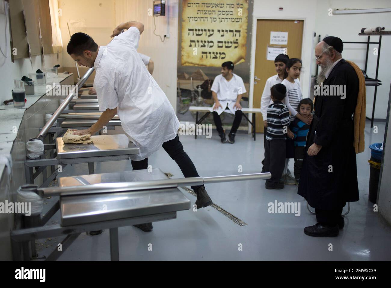 A Jewish baker makes matzo, a traditional handmade Passover unleavened