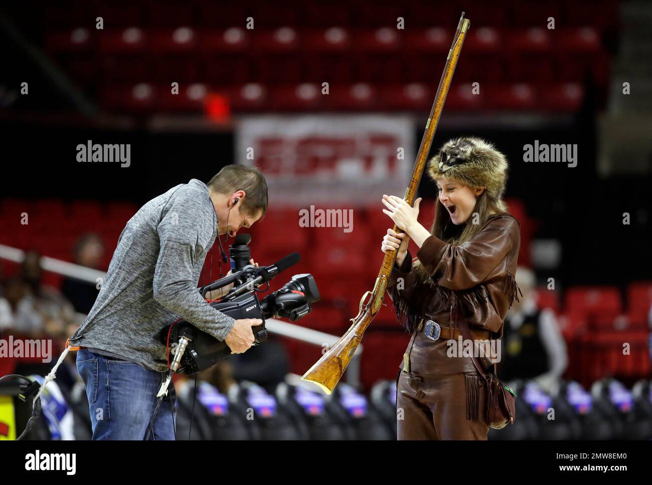 A West Virginia mountaineer mascot performs for a television camera