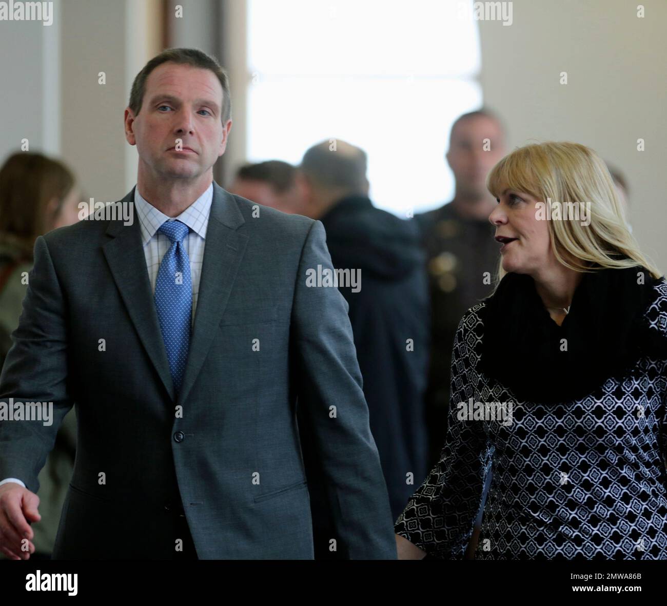 Curtis Lovelace walks with his wife, Christine, outside the courtroom(01)