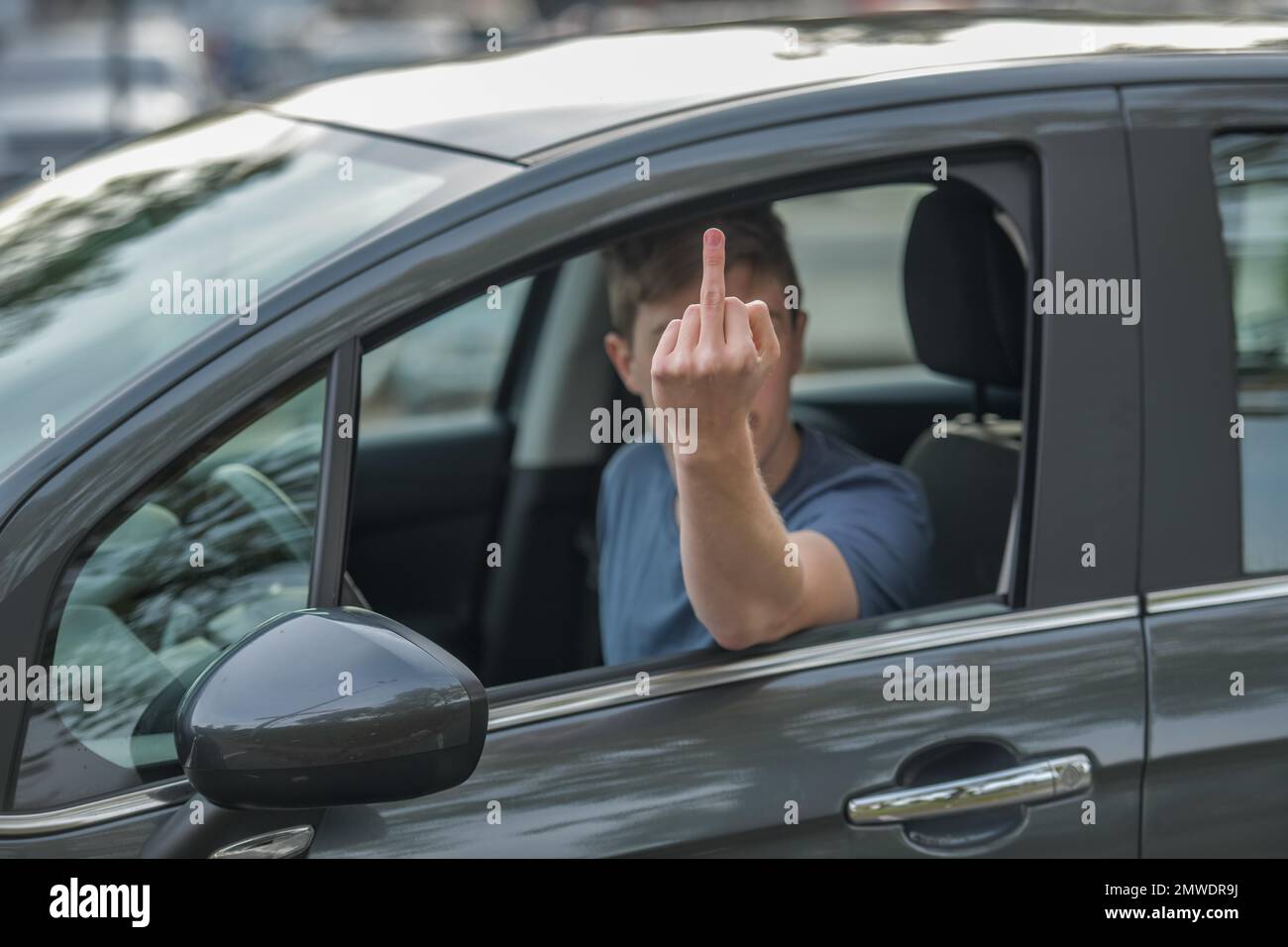 Symbolfoto, Beleidigung, stinkender Finger, Autofahrer Stockfoto