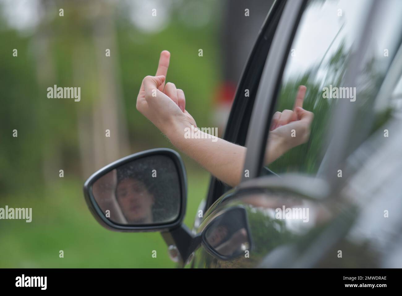 Symbolfoto, Beleidigung, stinkender Finger, Autofahrer Stockfoto