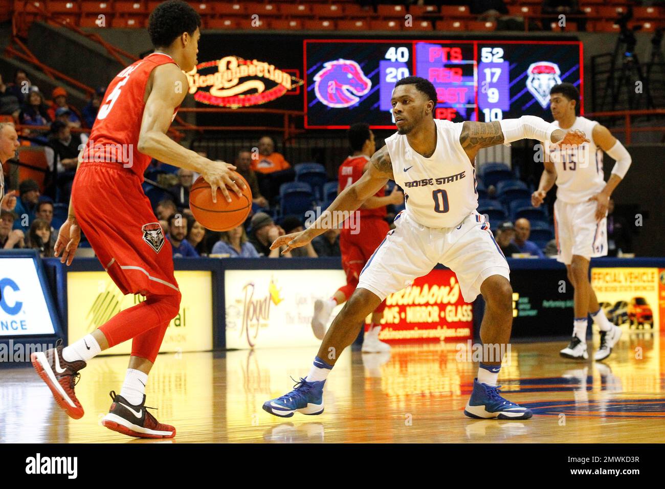 Boise State's Marcus Dickinson (0) defends New Mexico's Jalen Harris (5) during the second half of an NCAA college basketball game in Boise, Idaho, Tuesday, Jan. 17, 2017. New Mexico won 81-70. (AP Photo/Otto Kitsinger) Stockfoto