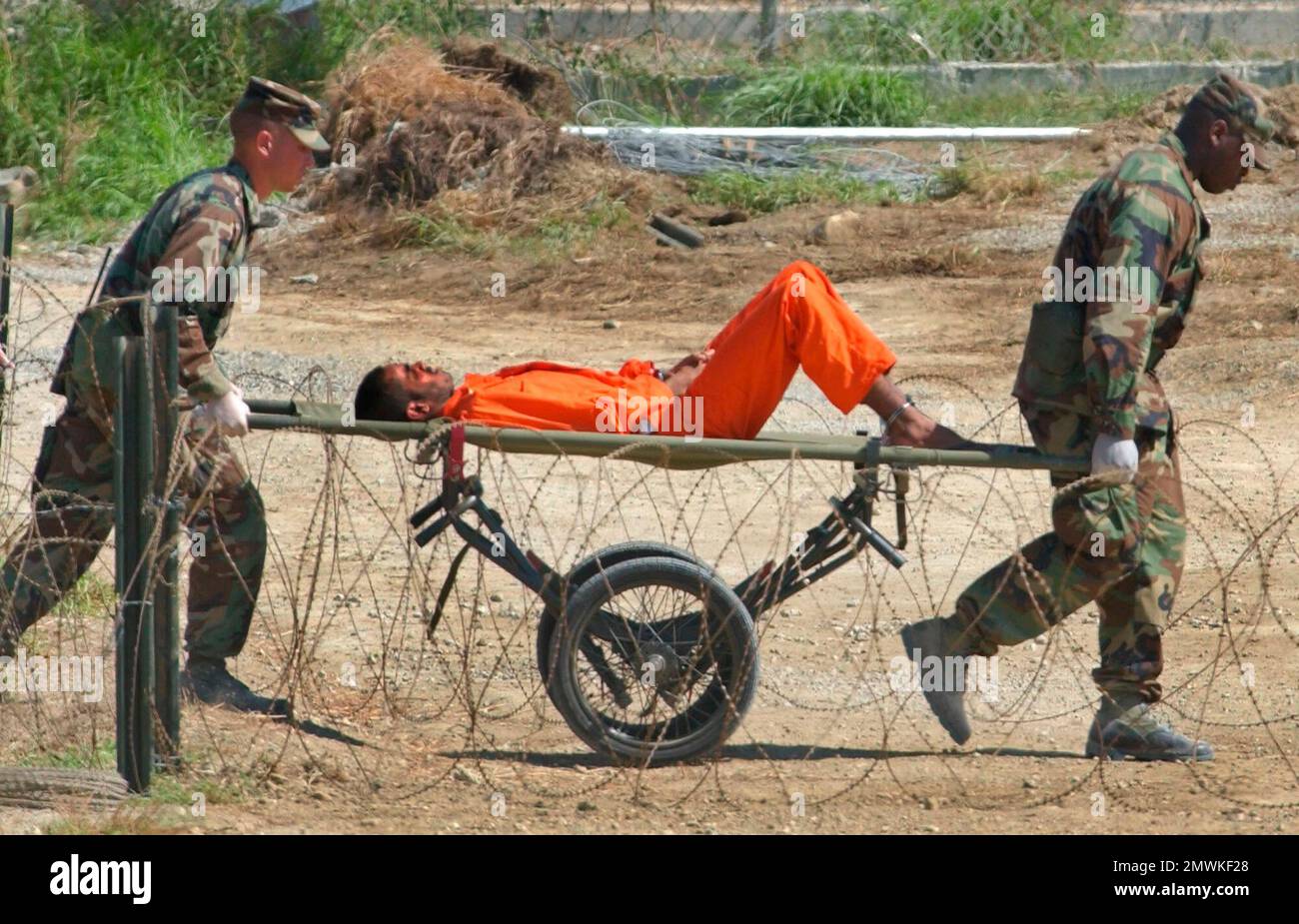 FILE In This Feb 2 2002 File Photo A Detainee From Afghanistan Is file-in-this-feb-2-2002-file-photo-a-detainee-from-afghanistan-is