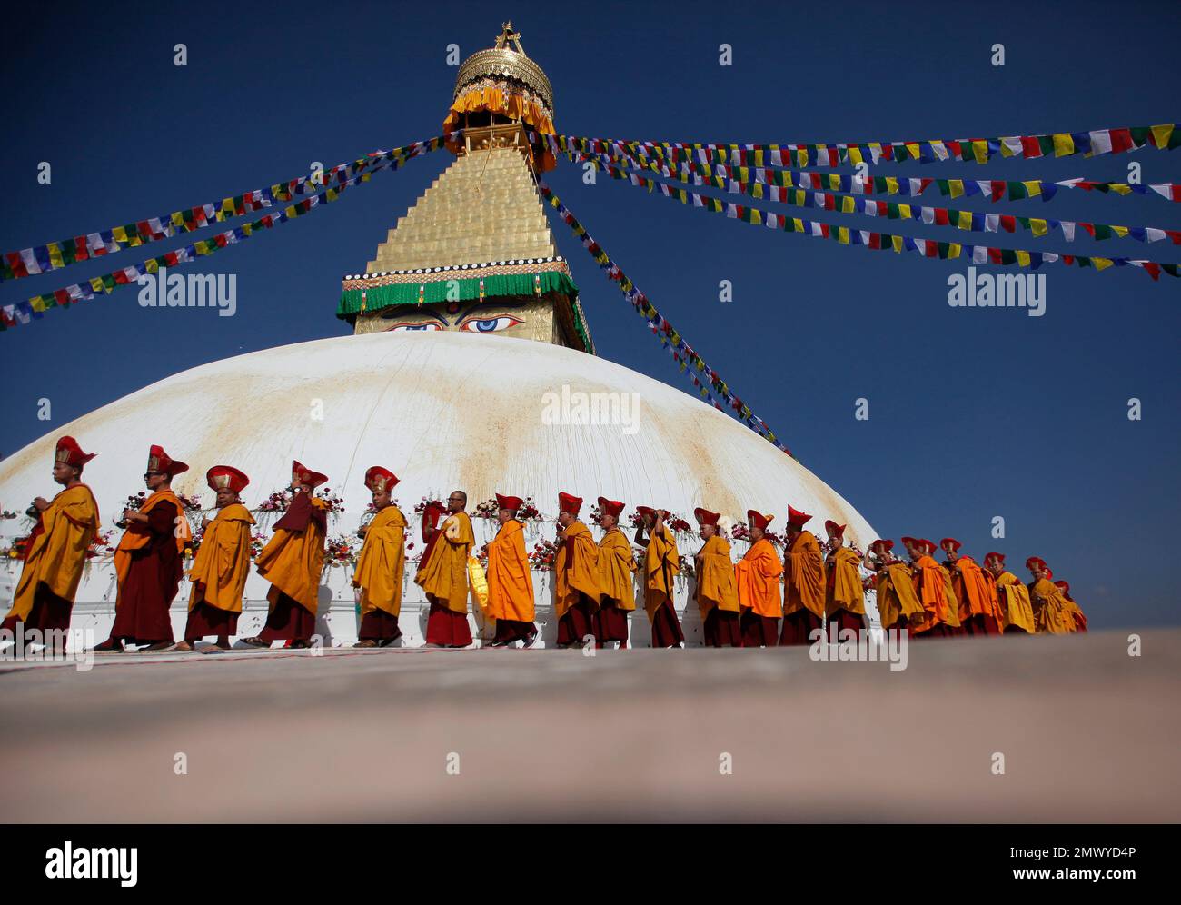 In this Sunday, Nov. 20, 2016 photo, Buddhist monks circle around the ...