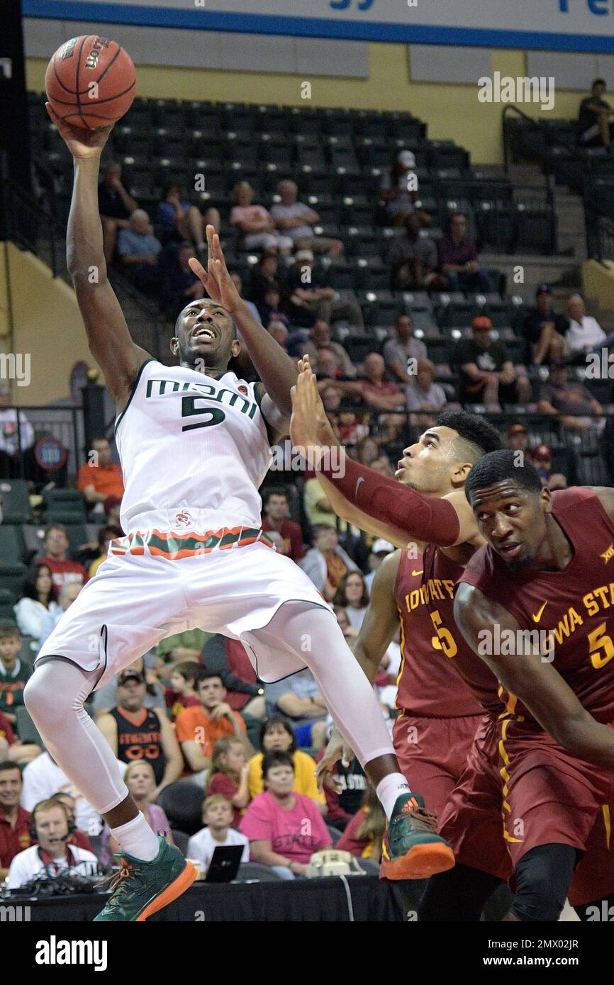 Miami guard Davon Reed (5) goes up for a shot in front of Iowa State