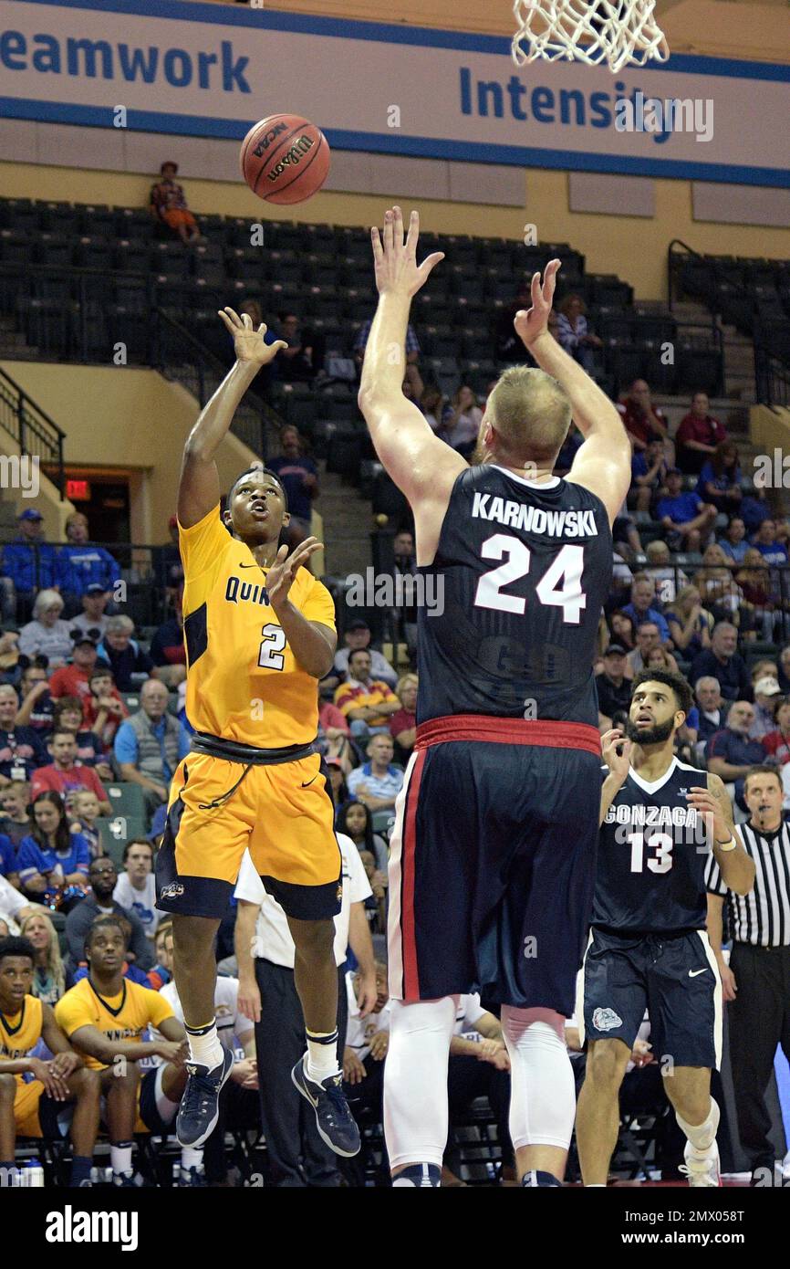 Quinnipiac guard Reggie Oliver (2) goes up for a shot in front of