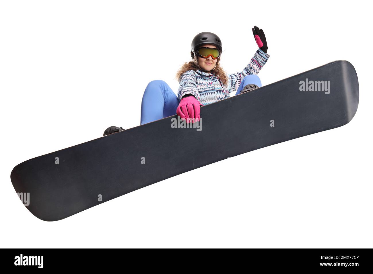 Eine Frau springt mit einem Snowboard, isoliert auf weißem Hintergrund Stockfoto